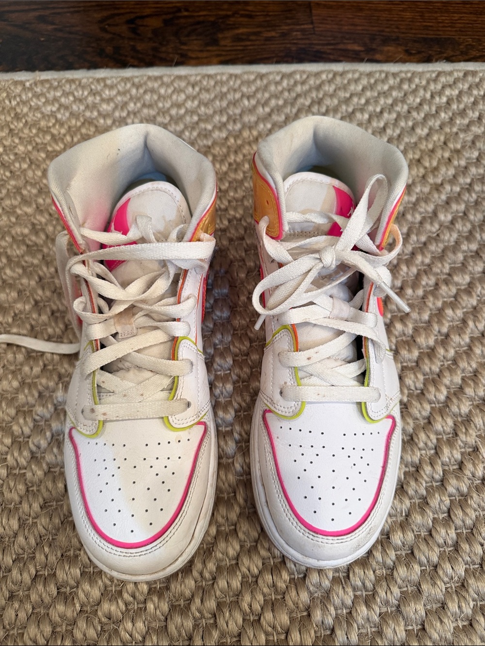 Kids White High-Top Nike Air Jordan Sneakers with Neon Pink and Yellow Trim